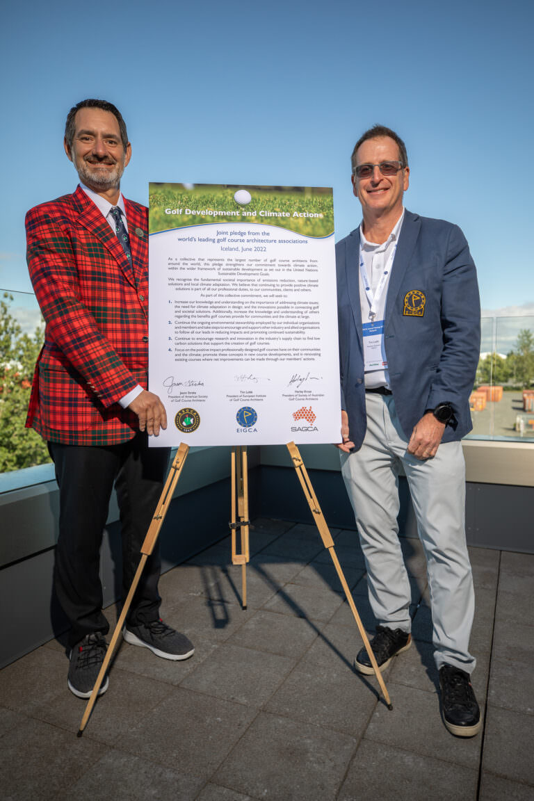 Jason Straka, ASGCA President (L) and Tim Lobb, EIGCA President (R) with the pledge signed of a commitment to climate action in golf